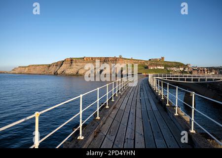 Looking back towards Whitby old town from the east pier Stock Photo