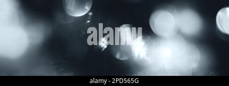 Blurred lights, gray, deep blue background, banner texture. Abstract bokeh with soft light header. Wide screen wallpaper. Panoramic web banner with co Stock Photo
