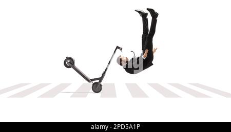 Businessman tumbling with an electric scooter on a pedestrian crossing isolated on white backgroundd Stock Photo