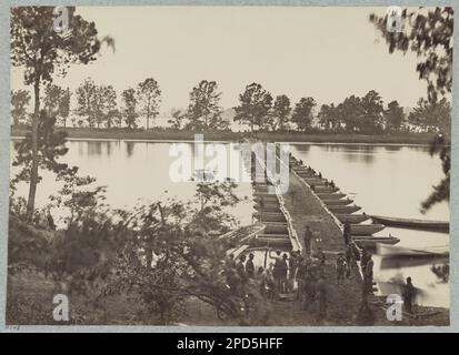 Pontoon bridge at Deep Bottom, James River, Virginia. No. B248, Title from item, Original negative in National Archives Record Group 111: Records of the Office of the Chief Signal Officer, 1860-1985, Series: Mathew Brady Photographs of Civil War-Era Personalities and Scenes, 1921-1940, Item: Pontoon bridge, Deep Bottom, James River, Va, Gift; Col. Godwin Ordway; 1948. United States, History, Civil War, 1861-1865, United States, Virginia, Deep Bottom. Stock Photo