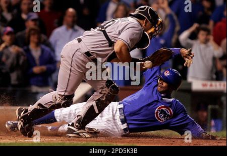 Florida Marlins' Juan Pierre scores on a Damion Easley base hit as