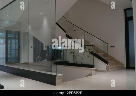 SARAJEVO, BOSNIA AND HERCEGOVINA, 30.8.2022: Interior marble stairs in business building, modern office interior with glass elements, stairs and fence Stock Photo