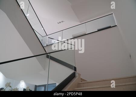 SARAJEVO, BOSNIA AND HERCEGOVINA, 30.8.2022: Interior marble stairs in business building, modern office interior with glass elements, stairs and fence Stock Photo