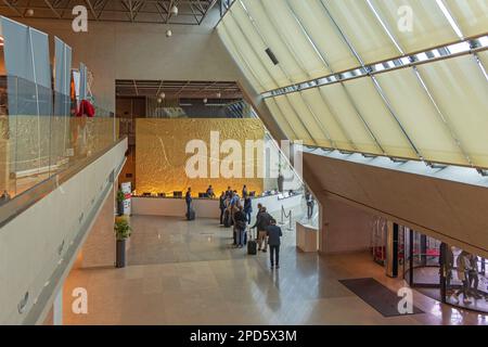 Belgrade, Serbia - November 02, 2022: Hotel Crowne Plaza Reception Hall Interior With Golden Relief of City. Stock Photo