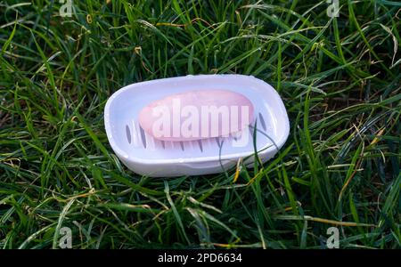 used soap in plastic dish ,health and personal hygiene concept. Stock Photo