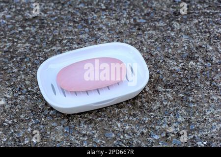 used soap in plastic dish ,health and personal hygiene concept. Stock Photo