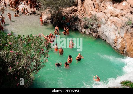 People in the Algar Waterfalls, near Alicante in Spain - Fonts de l'Algar, Province of Alicante, Valencia, Spain Stock Photo