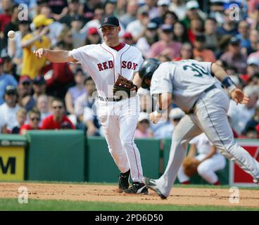 Seattle Mariners' Rene Rivera (30) high-fives with Yuniesky Bentancourt  after hitting a two run home run in the fifth inning of the 3-2 win over  the Los Angles Angels during their Turn