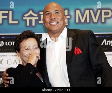 Half-Korean Super Bowl MVP Hines Ward of the Pittsburgh Steelers, right,  kisses his Korean mother Kim Young-hee upon their arrival at Incheon  International Airport, west of Seoul, South Korea, Monday, April 3