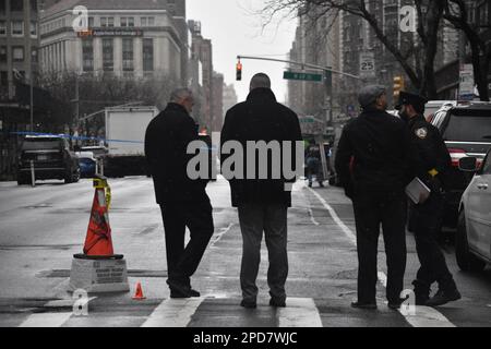 Manhattan, United States. 14th Mar, 2023. Investigators inspect the scene as shell casings are covered with cones. The New York City Police Department investigates a shooting in Manhattan of a 17-year-old male who was shot in broad daylight on West 68th St and Amsterdam Avenue. The 17-year-old victim was transported to hospital. The shooting happened near the Martin Luther King Jr. Educational Campus. (Photo by Kyle Mazza/SOPA Images/Sipa USA) Credit: Sipa USA/Alamy Live News Stock Photo
