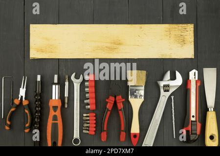 Tools on a rustic background with copy space. Working tools on a wooden rustic background. view from above Stock Photo