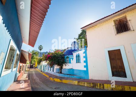 Amazing colorful buildings in pueblo magico Batopilas in Barrancas del Cobre mountains, Mexico Stock Photo