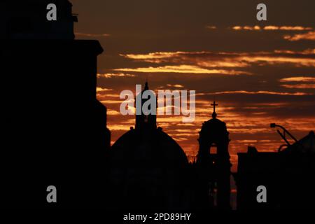 Mexico City, Mexico. 14th Mar, 2023. The silhouette of a church seen at sunrise in the Historic Center of Mexico City. on March 14, 2023 in Mexico City, Mexico. (Credit Image: © Carlos Santiago/eyepix via ZUMA Press Wire) EDITORIAL USAGE ONLY! Not for Commercial USAGE! Stock Photo