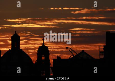 Mexico City, Mexico. 14th Mar, 2023. The silhouette of a church seen at sunrise in the Historic Center of Mexico City. on March 14, 2023 in Mexico City, Mexico. (Credit Image: © Carlos Santiago/eyepix via ZUMA Press Wire) EDITORIAL USAGE ONLY! Not for Commercial USAGE! Stock Photo