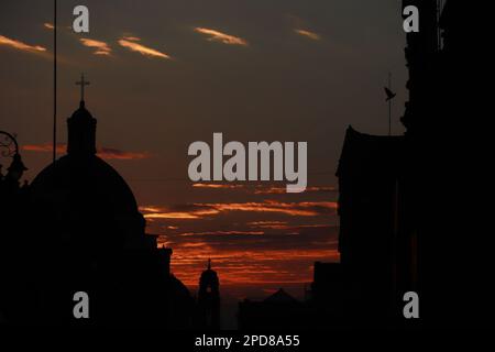 Mexico City, Mexico. 14th Mar, 2023. The silhouette of a church seen at sunrise in the Historic Center of Mexico City. on March 14, 2023 in Mexico City, Mexico. (Credit Image: © Carlos Santiago/eyepix via ZUMA Press Wire) EDITORIAL USAGE ONLY! Not for Commercial USAGE! Stock Photo