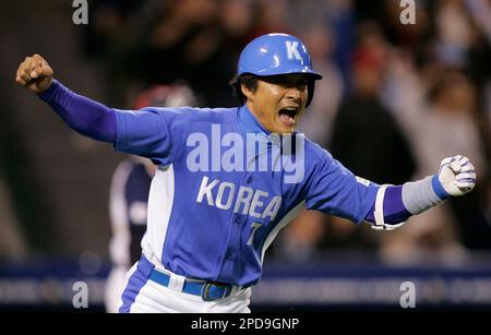 South Korea's Jong Beom Lee (#7) and Seung Youp Lee(#25) celebrate after  their