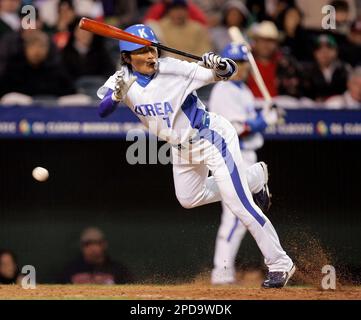 South Korea's Jong Beom Lee (#7) and Seung Youp Lee(#25) celebrate after  their