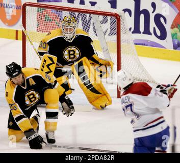 https://l450v.alamy.com/450v/2pda82r/montreal-canadiens-alex-kovalev-right-of-russia-scores-a-second-period-goal-between-the-legs-of-boston-bruins-goaltender-tim-thomas-center-as-defenseman-hal-gill-tries-to-defend-in-nhl-hockey-in-boston-thursday-march-8-2006-ap-photowinslow-townson-2pda82r.jpg