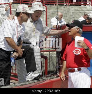 Chuck Tanner, manager of the 1979 world champion Pittsburgh Pirates, draws  a laugh from players of that team, Dave Parker, right, Steve Nicosia,  center, and Omar Moreno, left, as he plays with