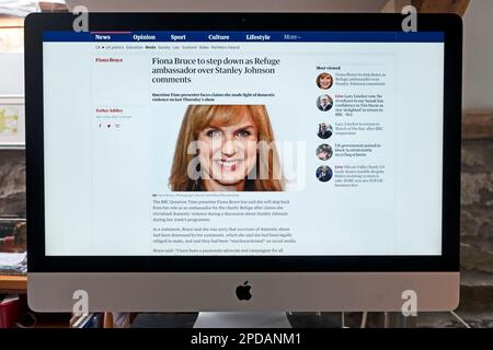'Fiona Bruce to step down as Refuge ambassador over Stanley Johnson comments' Guardian newspaper headline on website screen on 13 March 2023 London UK Stock Photo
