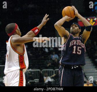 New Jersey Nets Vince Carter (15) drives toward the basket past Atlanta  Hawks Josh Smith (5) in the first period March 31, 2006, in Atlanta's  Phillips Arena. The Nets defeated the Hawks