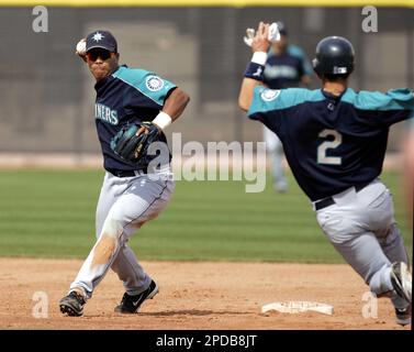 Seattle Mariners infielder Jose Lopez catches a ball during baseball spring  training Wednesday, Feb. 18, 20009 in Peoria, Ariz. (AP Photo/Charlie  Riedel Stock Photo - Alamy
