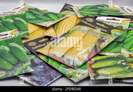 Kyiv, Ukraine - May 06, 2022: Studio shoot of TM Elit seed kits mix for growing cucumbers, corn, peas and basil in the garden closeup on white. Stock Photo