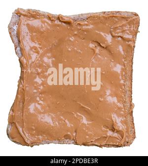 Organic Peanut Butter Spread Over A Piece Of Wholemeal Bread, Isolated On A White Background Stock Photo