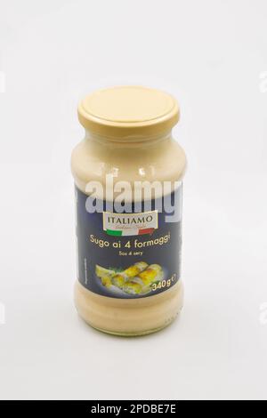 Kyiv, Ukraine - June 01, 2022: Studio shoot of Italiamo 4 Cheese Sauce bottle closeup on white. Creamy cheese sauce for pasta and salad in glass jar. Stock Photo