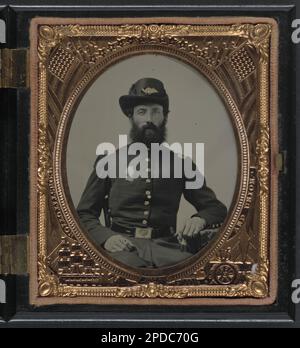 Unidentified soldier in Union frock coat with pin of a profile bust portrait of an unidentified man and Hardee hat. Liljenquist Family Collection of Civil War Photographs , NewsetLilj02, pp/liljunion. United States, Army, People, 1860-1870, Military uniforms, Union, 1860-1870, Soldiers, Union, 1860-1870, United States, History, Civil War, 1861-1865, Military personnel, Union. Stock Photo