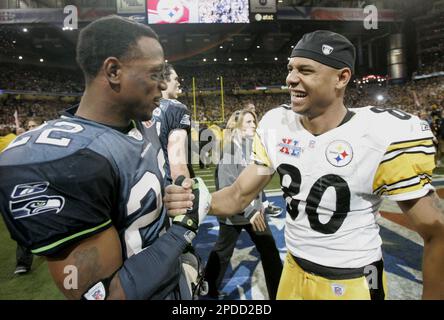 Seattle Seahawks cornerback Jimmy Williams (22) and linebacker Lofa Tatupu  (51) celebrate after stopping the Tennessee Titans on a fourth down play in  the fourth quarter. The Seahawks defeated the Titans, 28-24