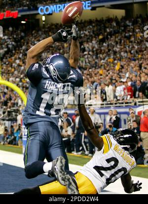 Seattle Seahawks' D.J. Hackett (18) misses catching the ball in the endzone  as Dallas Cowboys' Terence Newman defends in the second quarter in an NFC  wild-card playoff football game Saturday, Jan. 6