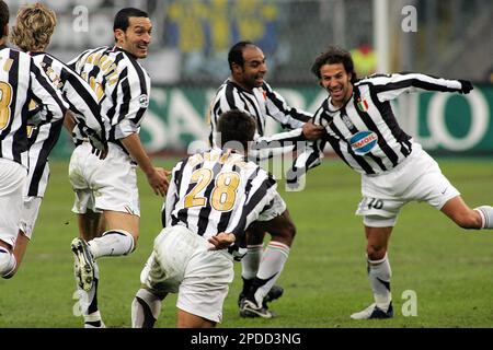 Juventus striker Alessandro Del Piero, center, followed by teammate Giorgio  Chiellini, left, with other teammates, warms-up next to an Italian Serie B  second division sign, at bottom, before the start of the