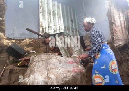 (230314) -- BLANTYRE (MALAWI), March 14, 2023 (Xinhua) -- A woman is seen at a damaged house in Blantyre, Malawi, on March 14, 2023. Tropical Cyclone Freddy has continued to cause devastation in the southern African region as the death toll from disasters such as flash floods and mudslides continues to rise. In Malawi, where the impact of the cyclone looks the most severe, the death toll has risen to 190 as more bodies were found Tuesday following the damages caused by tropical cyclone Freddy, which has now affected 12 districts and cities in the southern African nation, according to the count Stock Photo