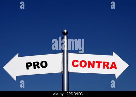 signposts pointing in different directions, options pro - contra Stock Photo