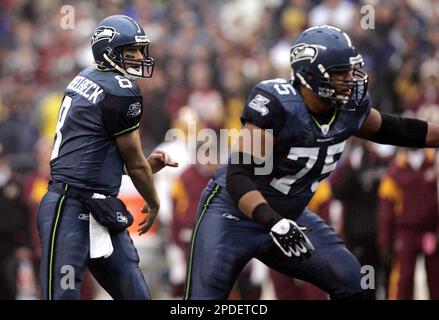 Seattle Seahawks offensive tackle Chris Gray (62) walks with defensive end  Bryce Fisher (94) to practice on Friday, Jan. 27, 2006 in Kirkland, Wash.  Gray, the Seahawks' quiet, reflective right guard, has