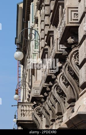 Sunlight and shadows, emphasise, the detail in the delicate stone carving on the CR Trieste Foundation building, Trieste, northern Italy. Stock Photo