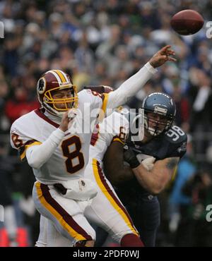 Pittsburgh Steelers Ben Roethlisberger is pursued by Seattle Seahawks Grant  Wistrom in first quarter of Super Bowl XL featuring the Seattle Seahawks  and the Pittsburgh Steelers at Ford Field in Detroit, Mi.