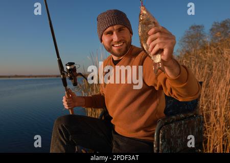 Fisherman Rod Caught Fish Riverside Stock Photo by ©NewAfrica 531694916