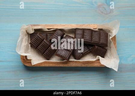 Tray with delicious hematogen on blue wooden table, top view Stock Photo