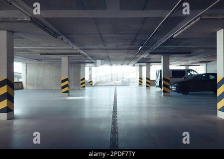 Open car parking garage with ramp on sunny day Stock Photo