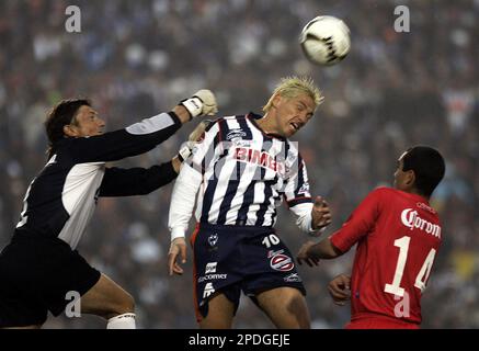 Monterrey's soccer player Guillermo Franco, front, from Argentina head the  ball as Toluca' Carlos Esquivel challenges during the first leg of the  Mexican league championship soccer final at the Nemecio Diez stadium