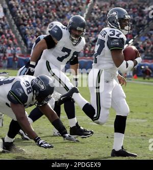 Seattle Seahawks running back Shawn Alexander (37) scores a touchdown on a  1-yard run against the Tennessee Titans during the first quarter of an NFL  football game Sunday, Dec. 18, 2005, in Nashville, Tenn. Blocking for  Alexander are Mack Strong (38