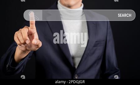 Male hand touching search bar for search engine optimization. Looking for information or data through an internet connection. Stock Photo