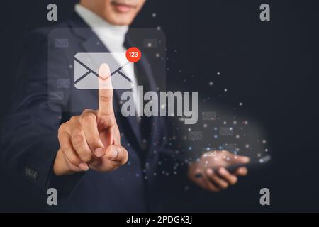 Businessman touching email on virtual screen. electronic message. Email notification concept. Stock Photo