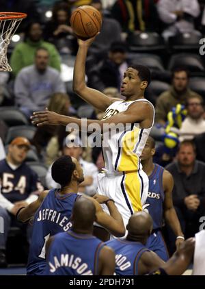 Indiana Pacers Danny Granger, bottom, gets landed on by Boston