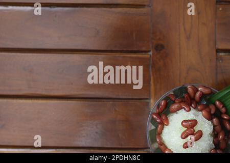 Es Kacang Merah or a cold drink made from red beans boiled with brown sugar served with coconut milk, shaved ice and covered with sweetened condensed Stock Photo