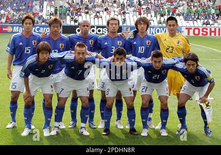 The Japanese national soccer team pose for a team photo before the