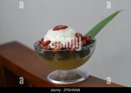 Es Kacang Merah or a cold drink made from red beans boiled with brown sugar served with coconut milk, shaved ice and covered with sweetened condensed Stock Photo