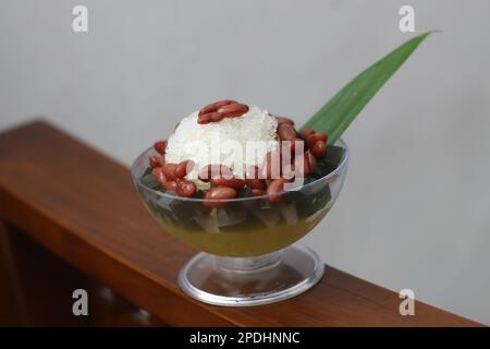 Es Kacang Merah or a cold drink made from red beans boiled with brown sugar served with coconut milk, shaved ice and covered with sweetened condensed Stock Photo